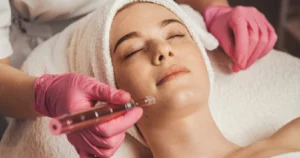A woman receiving a professional microneedling facial treatment at a spa in Meridian, Idaho